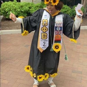 All black graduation gown with sunflowers